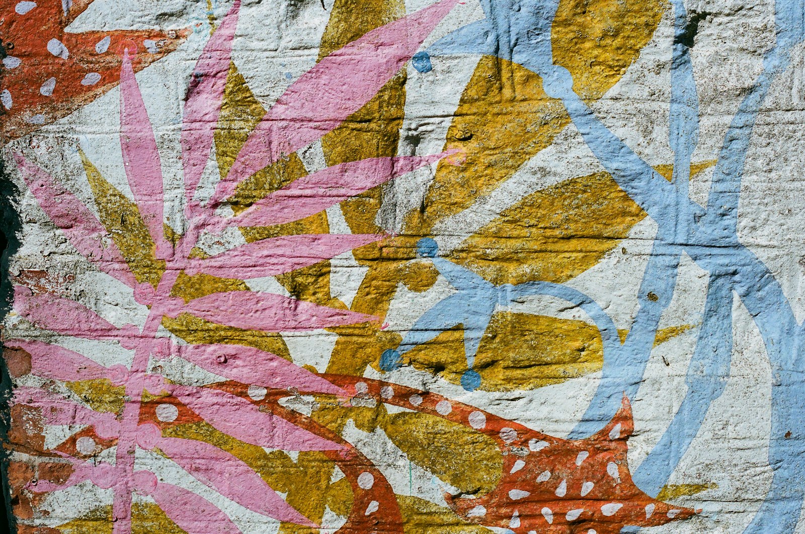 Colorful abstract graffiti covering a brick wall