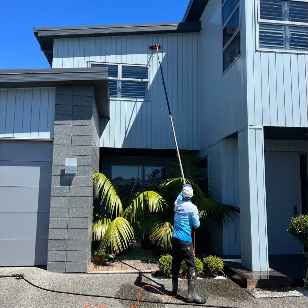 Soft wash low-pressure technique applied to a Miami tile roof